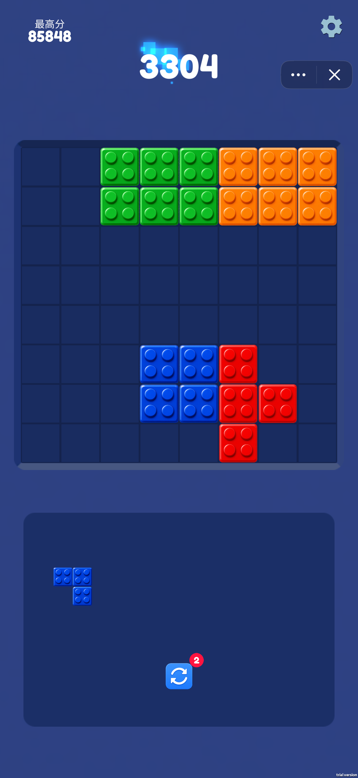 The current score is 3304 and the best score is 85848. A blue three-cell corner piece remains in the tray; compare its outline with empty cells before committing a placement. The circular-arrow tool has a badge of 2.